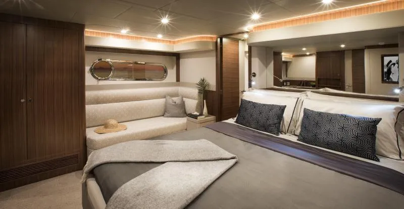 Slide: The Image of Luxurious master bedroom in the 2024 Belize 66 Sedan yacht. - 12