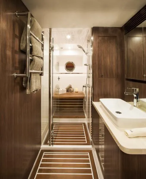 Slide: The Image of Luxurious bathroom in 2024 Belize 66 Sedan yacht with modern fixtures and wooden accents. - 14