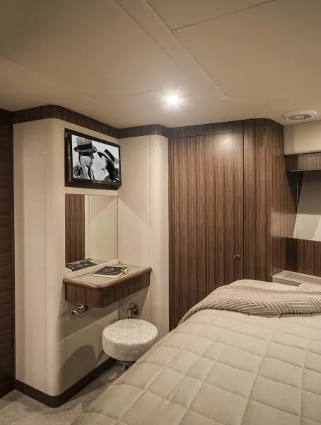 Slide: The Image of Luxurious interior of 2024 Belize 66 Sedan yacht with cozy bedroom and TV. - 17