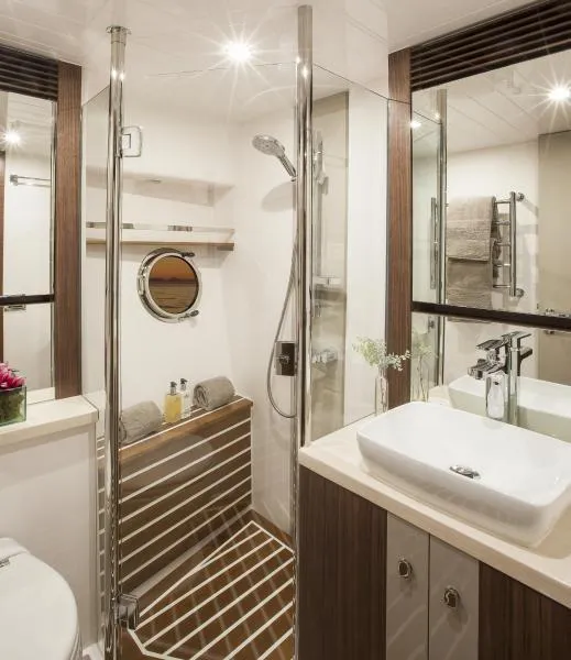 Slide: The Image of Luxurious bathroom in 2024 Belize 66 Sedan yacht with modern fixtures and glass shower. - 18