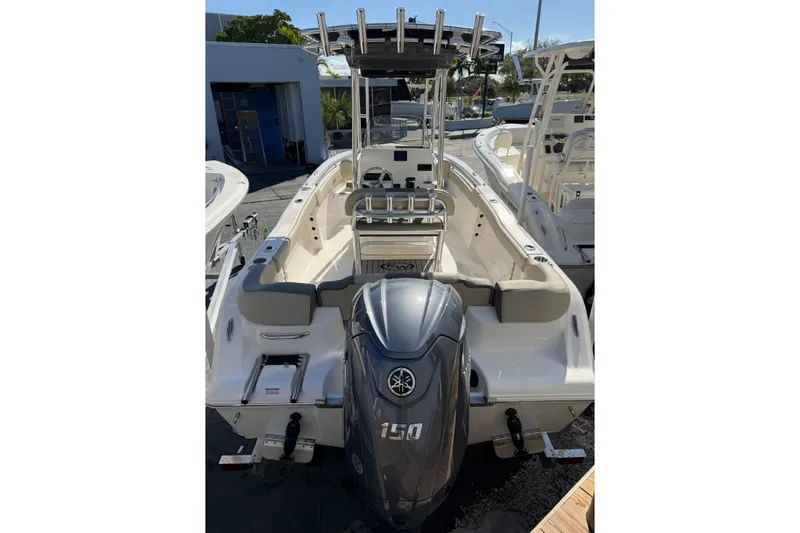 Slide: The Image of 2026 Key West 203 FS boat with Yamaha 150 engine, docked outdoors. - 10