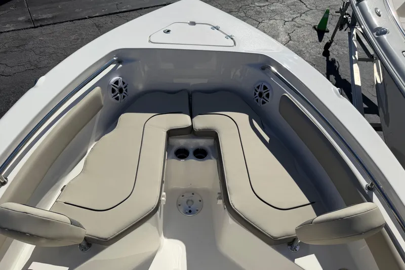 Slide: The Image of 2026 Key West 203 FS boat interior with cushioned seating and cup holders. - 15