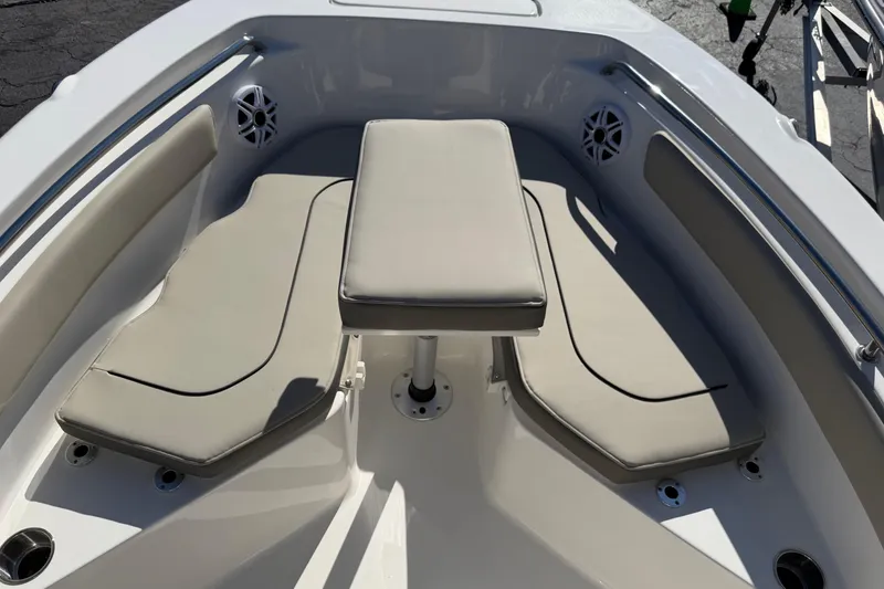 Slide: The Image of 2026 Key West 203 FS boat interior with cushioned seating and table. - 17