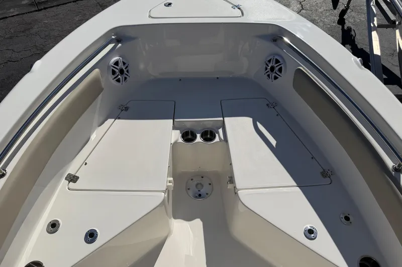 Slide: The Image of 2026 Key West 203 FS boat interior with seating and storage compartments. - 18