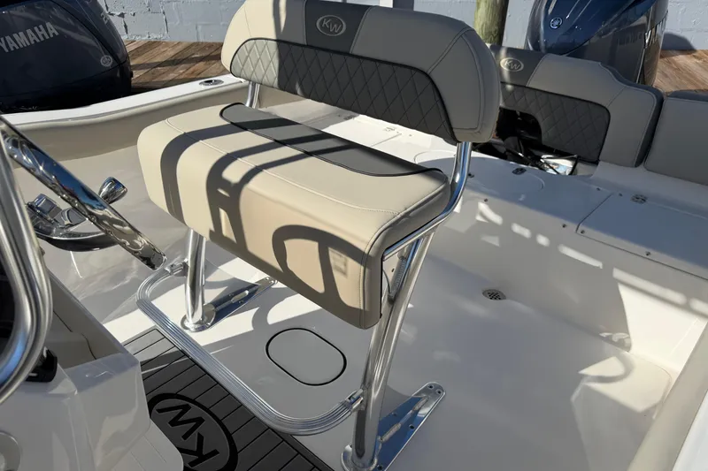Slide: The Image of 2026 Key West 203 FS boat interior with cushioned seating and chrome details. - 22