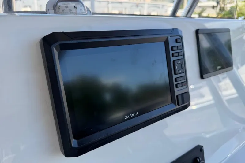 Slide: The Image of Garmin navigation system on 2026 Key West 203 FS boat dashboard. - 26