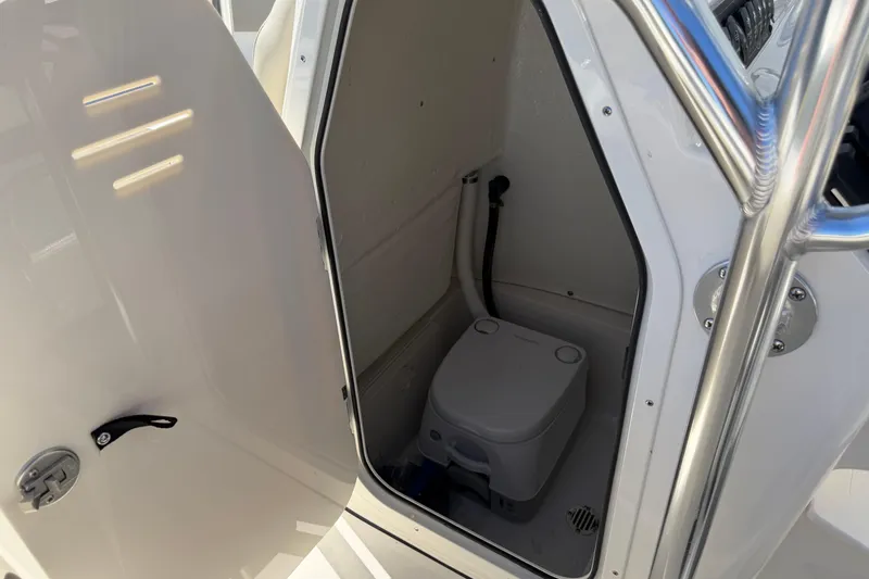 Slide: The Image of 2026 Key West 203 FS boat interior with compact marine toilet. - 31