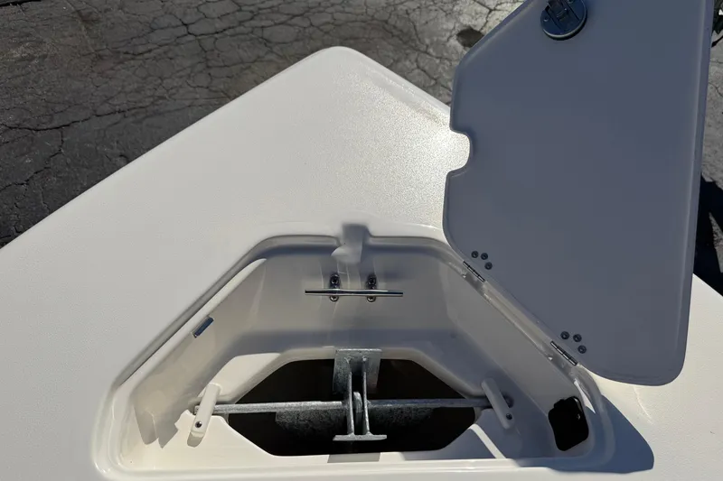 Slide: The Image of Open anchor compartment on 2026 Key West 203 FS boat, showing storage details. - 32