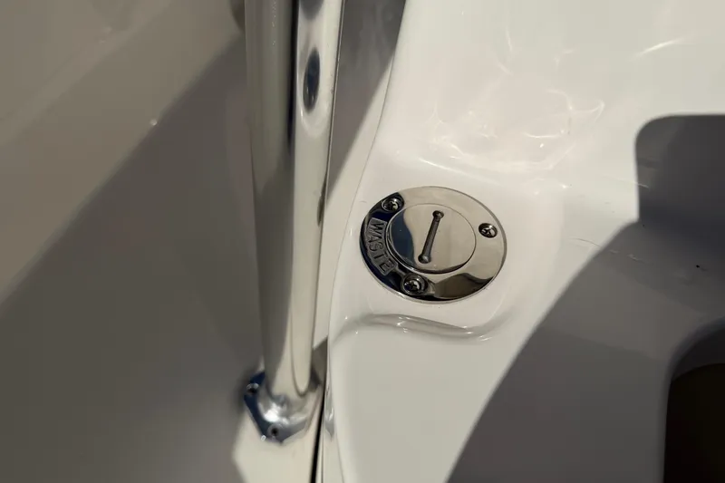 Slide: The Image of Key West 203 FS 2026 boat waste cap and chrome railing detail. - 35
