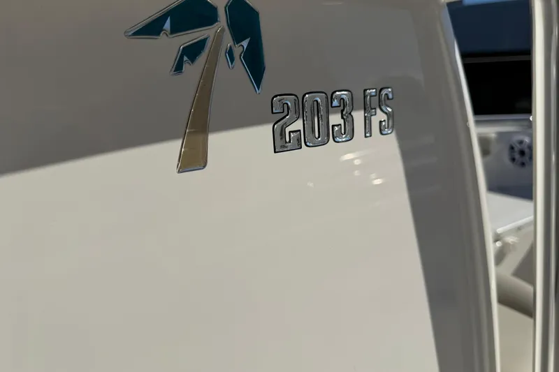 Slide: The Image of Key West 203 FS boat emblem, 2026 model, featuring a palm tree logo. - 37