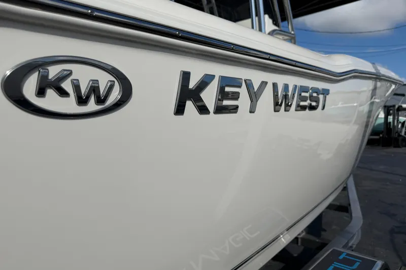 Slide: The Image of 2026 Key West 203 FS boat with sleek branding and logo detail. - 38