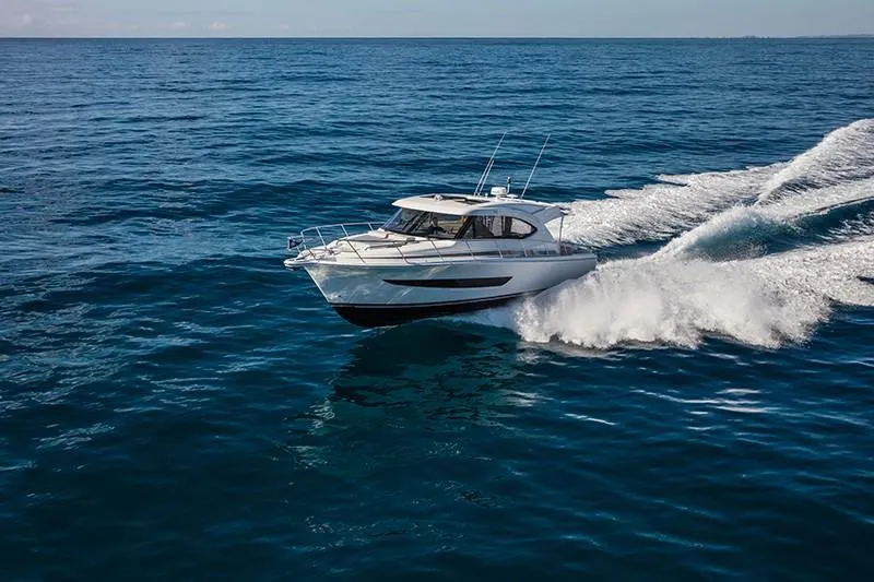 The Image of 2024 Riviera 395 SUV cruising on open water. - 0