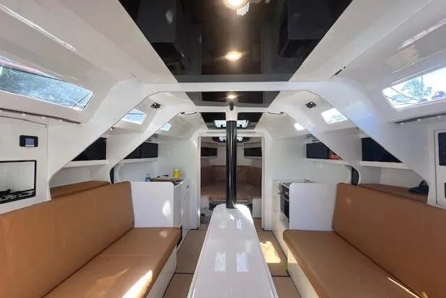 Slide: The Image of Interior of 2024 Neo 43 Romo yacht with modern design and brown seating. - 16