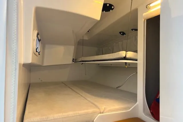 Slide: The Image of Interior cabin of 2024 Neo 43 Romo yacht with cushioned sleeping area. - 19