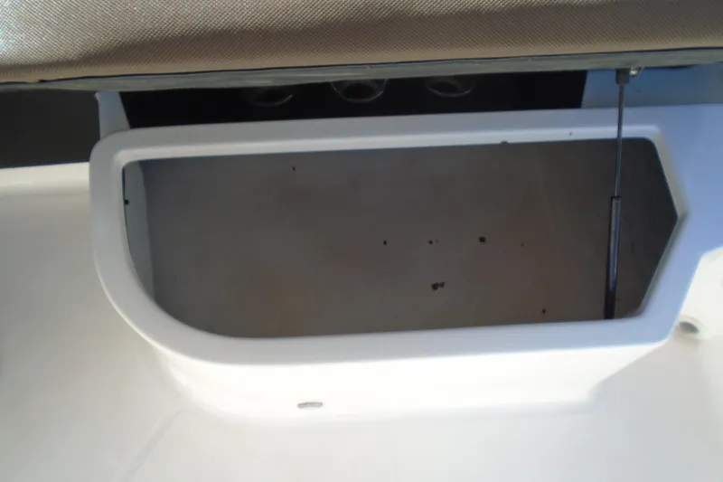 Slide: The Image of Storage compartment in a 2014 Regal 2300 Bowrider boat. - 13