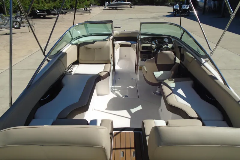 Slide: The Image of 2014 Regal 2300 Bowrider interior with spacious seating and modern dashboard. - 8