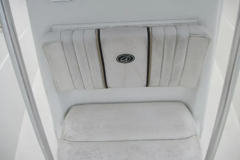Slide: The Image of 2005 Sailfish 236 CC boat seat with padded backrest and logo emblem. - 8