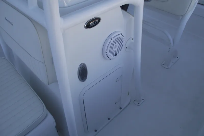 Slide: The Image of Interior of a 2021 Savannah SS21 boat, featuring seating and speaker system. - 15