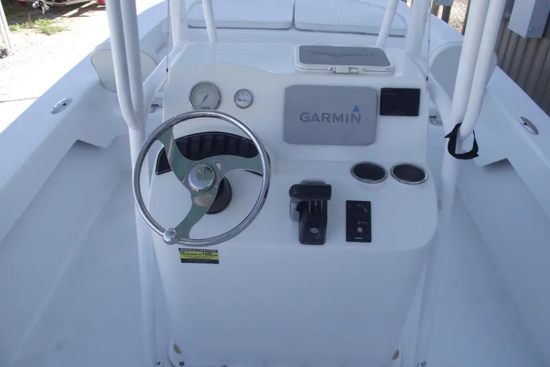 Slide: The Image of 2021 Savannah SS21 boat console with Garmin navigation and steering wheel. - 18