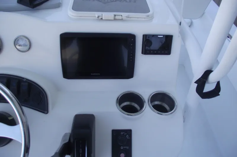 Slide: The Image of Control panel of 2021 Savannah SS21 boat with Garmin display and cup holders. - 19