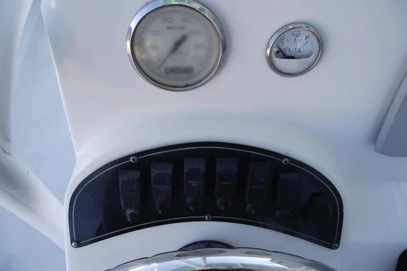 Slide: The Image of Dashboard of a 2021 Savannah SS21 boat with gauges and switches. - 20