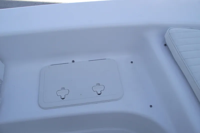 Slide: The Image of Interior view of a 2021 Savannah SS21 boat, featuring a storage compartment and seating. - 7