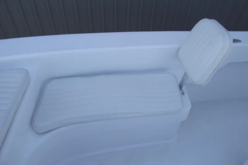 Slide: The Image of White cushioned seating on 2021 Savannah SS21 boat, featuring sleek design and comfort. - 9