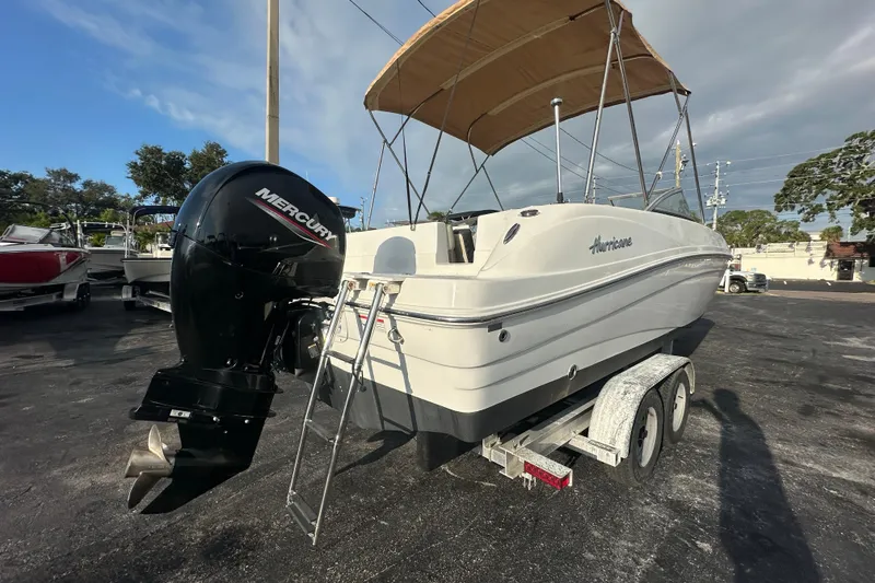 Slide: The Image of 2020 Hurricane SunDeck 217 OB boat with Mercury outboard motor on trailer. - 3