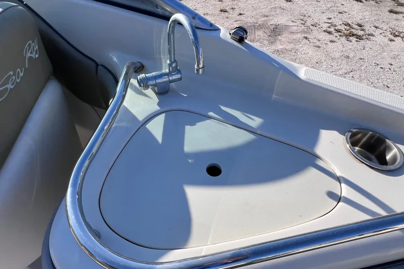 Slide: The Image of 2006 Sea Ray 240 Sundeck boat sink with faucet and cup holder. - 15