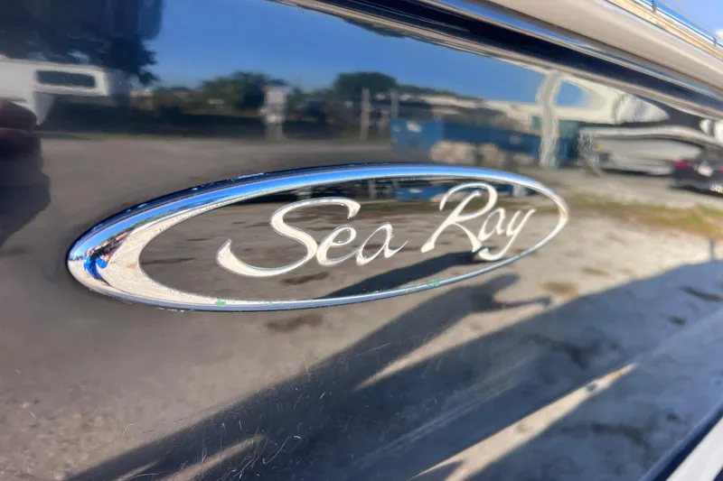Slide: The Image of 2006 Sea Ray 240 Sundeck logo on sleek boat exterior. - 7