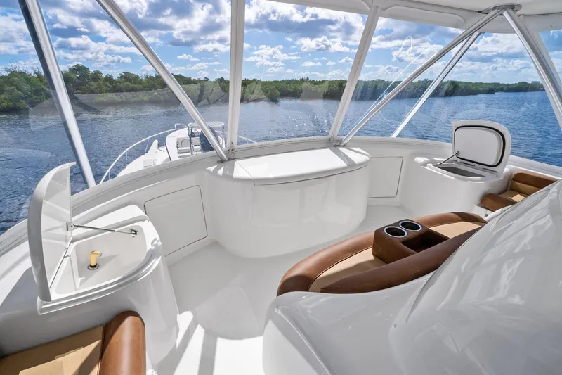 Slide: The Image of Luxurious interior of 2015 Viking 66' Convertible yacht with panoramic water views. - 18