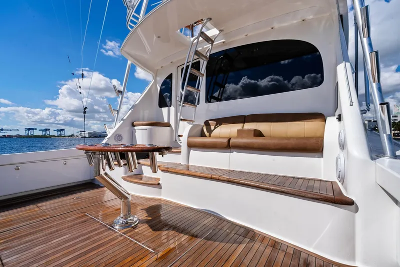 Slide: The Image of Luxurious 2015 Viking 66' Convertible yacht with elegant deck seating and ocean view. - 29