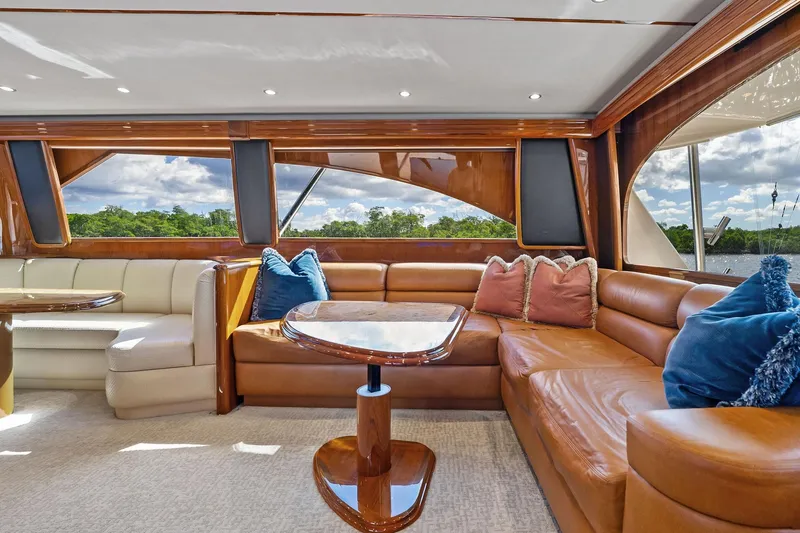 Slide: The Image of Luxurious interior of 2015 Viking 66' Convertible yacht with plush seating and elegant decor. - 33