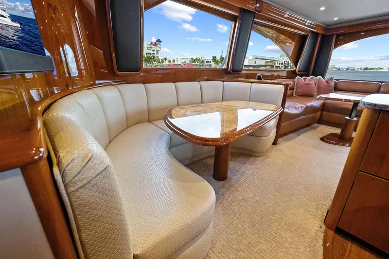 Slide: The Image of Luxurious interior of 2015 Viking 66' Convertible yacht with elegant seating and panoramic windows. - 34