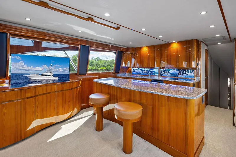 Slide: The Image of Luxurious interior of 2015 Viking 66' Convertible yacht with elegant wood finishes and modern amenities. - 35