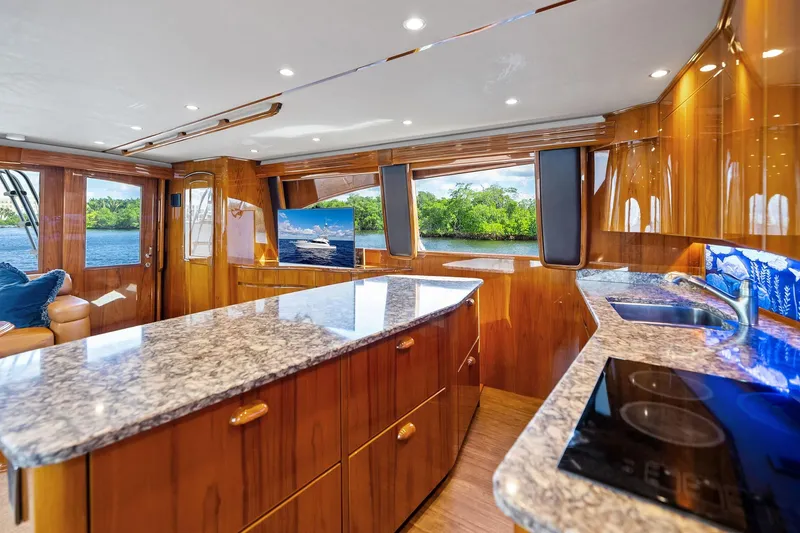 Slide: The Image of Luxurious interior of 2015 Viking 66' Convertible yacht with polished wood and granite finishes. - 37