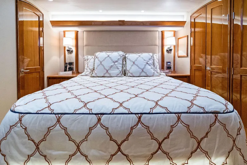 Slide: The Image of Luxurious bedroom interior of 2015 Viking 66' Convertible yacht with elegant bedding. - 38