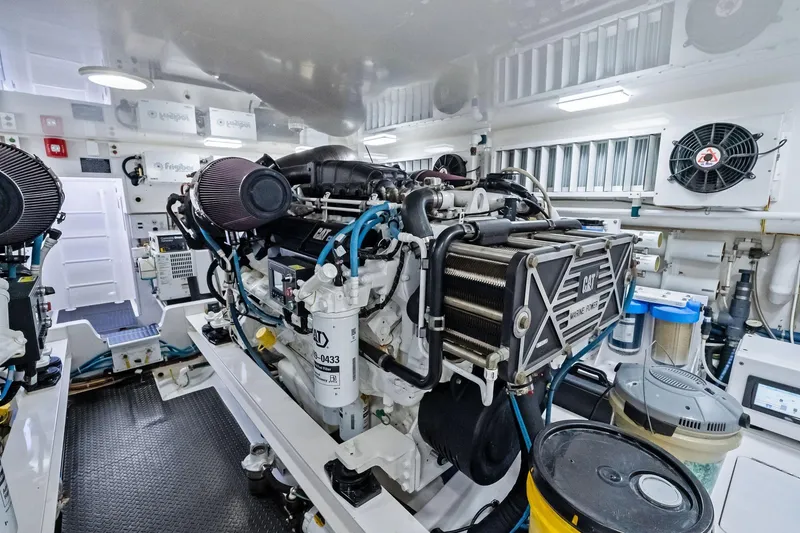Slide: The Image of Engine room of 2015 Viking 66' Convertible yacht, featuring CAT marine power engine. - 53