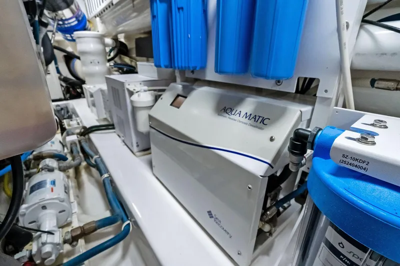 Slide: The Image of Engine room of 2015 Viking 66' Convertible with Aqua Matic water filtration system. - 57