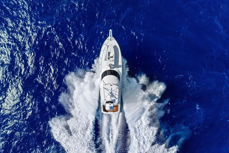 Slide: The Image of Aerial view of 2015 Viking 66' Convertible yacht cruising in deep blue ocean. - 8