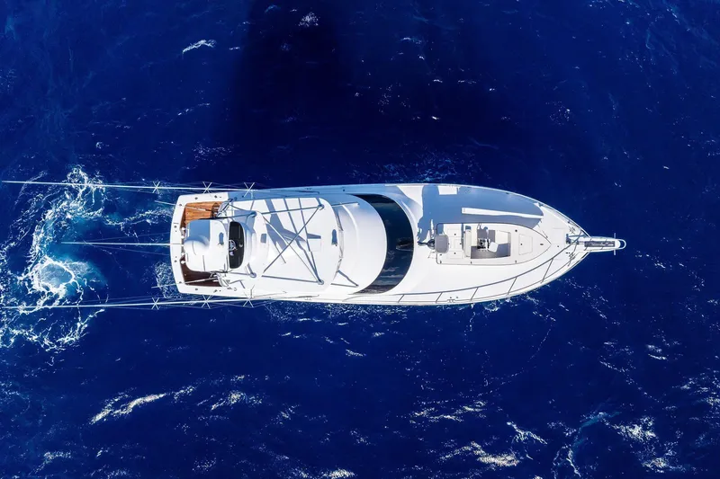 Slide: The Image of Aerial view of 2015 Viking 66' Convertible yacht cruising in deep blue ocean. - 9