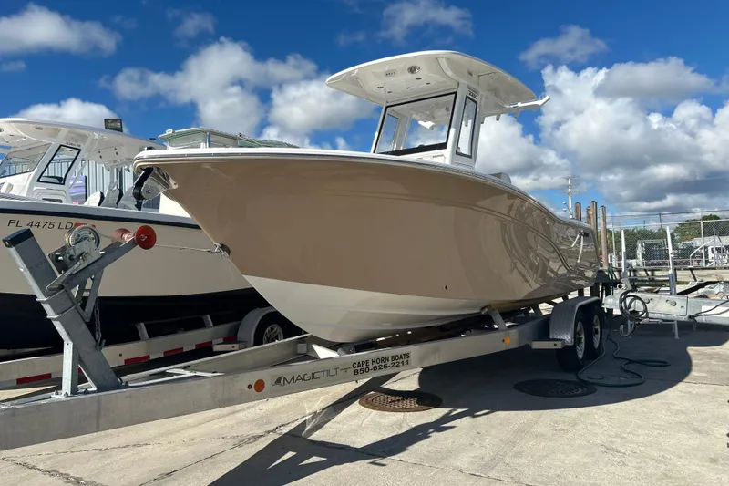 The Image of 2026 Sea Fox 228 Commander boat on trailer under clear blue sky. - 0