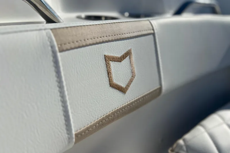 Slide: The Image of 2026 Sea Fox 228 Commander interior detail with logo on white upholstery. - 12