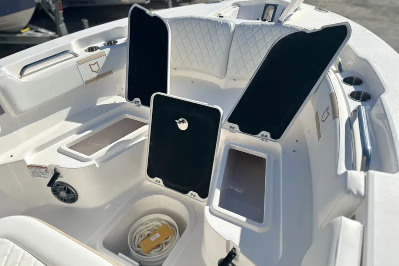 Slide: The Image of 2026 Sea Fox 228 Commander boat interior with open storage compartments and seating. - 14