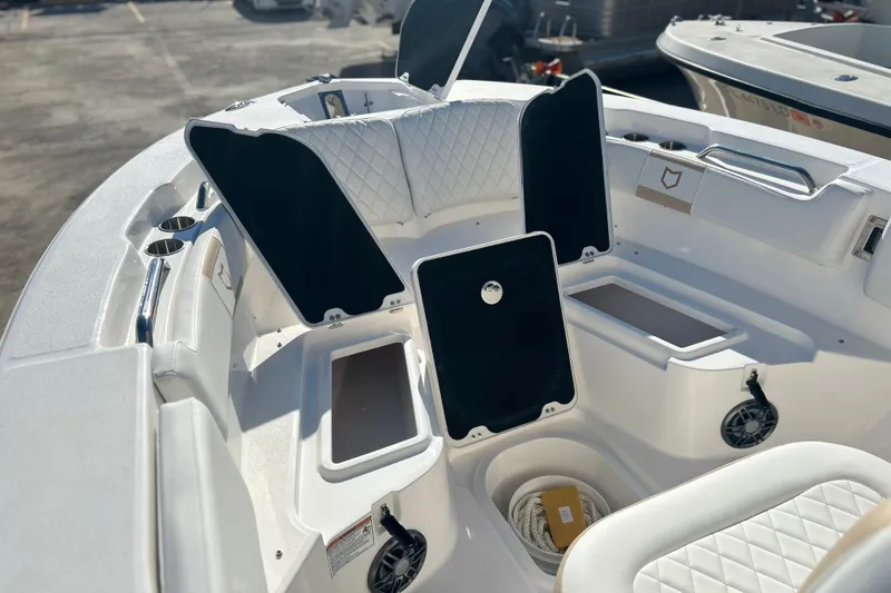 Slide: The Image of 2026 Sea Fox 228 Commander boat interior with open storage compartments and seating. - 15