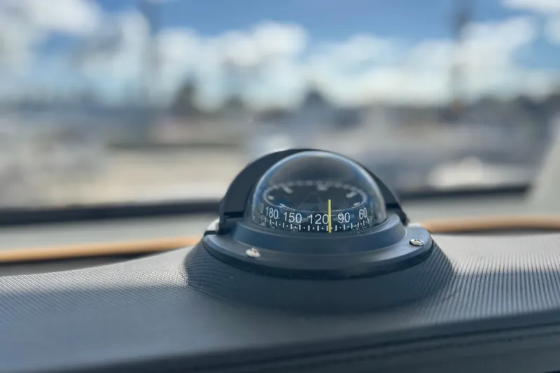 Slide: The Image of Compass on 2026 Sea Fox 228 Commander boat dashboard, with blurred background. - 25