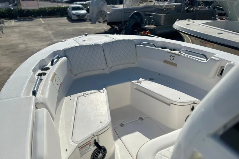 Slide: The Image of 2026 Sea Fox 228 Commander boat interior with cushioned seating and storage compartments. - 26