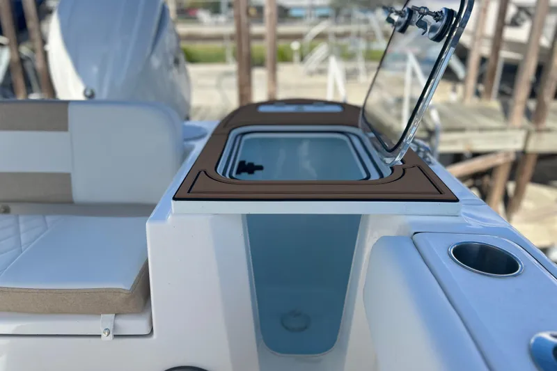 Slide: The Image of 2026 Sea Fox 228 Commander boat interior with open storage compartment and seating. - 28