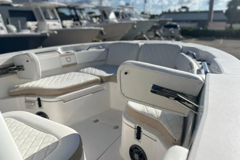 Slide: The Image of 2026 Sea Fox 228 Commander boat interior with white cushioned seating. - 3