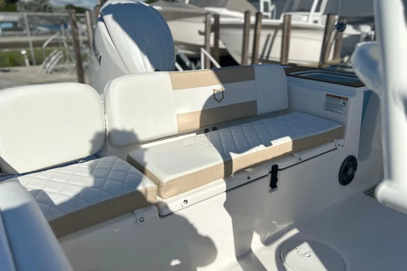 Slide: The Image of 2026 Sea Fox 228 Commander boat interior with cushioned seating and storage. - 33